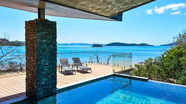 An infinity pool with a clear view of the sea and distant islands. - Hidden Cove 17 (Hamilton Island)
