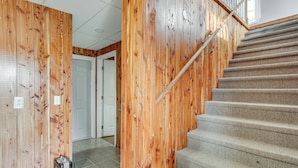 A staircase with wooden walls and carpeted steps. - Near Tennessee River! Pet-Friendly Family Cottage! (Savannah)
