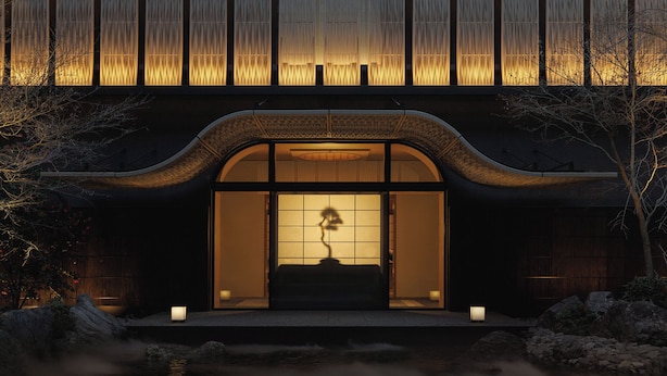 A traditional building with a curved roof, a water feature in front, and a view of the interior through a large window. - Capella Kyoto (Kyoto)