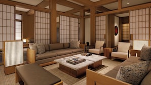 A traditional Japanese-style living room with tatami flooring, low wooden beams, and sliding shoji screens. - Capella Kyoto (Kyoto)