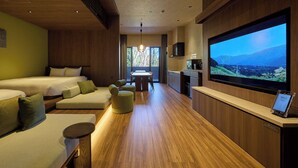 A modern hotel room with two beds, a seating area, a TV, and a kitchenette. - Rakuten STAY VILLA Yufuin Onsen (Yufu)