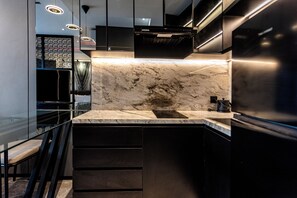 Deluxe Studio Suite, 1 King Bed, City View | Private kitchen | Mini-fridge, microwave, dishwasher, coffee/tea maker - The Umalas Signature (Kerobokan)