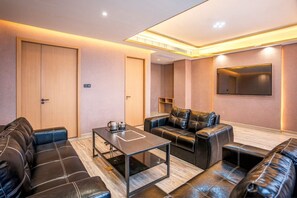 Deluxe Suite, City View | Desk, laptop workspace, blackout drapes, iron/ironing board - BCN Barna Hotel (Ta Khmau)