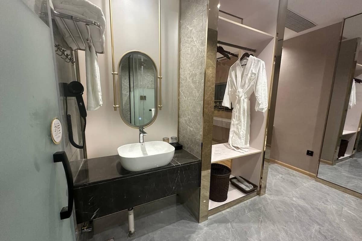 Deluxe Suite, City View | Desk, laptop workspace, blackout drapes, iron/ironing board