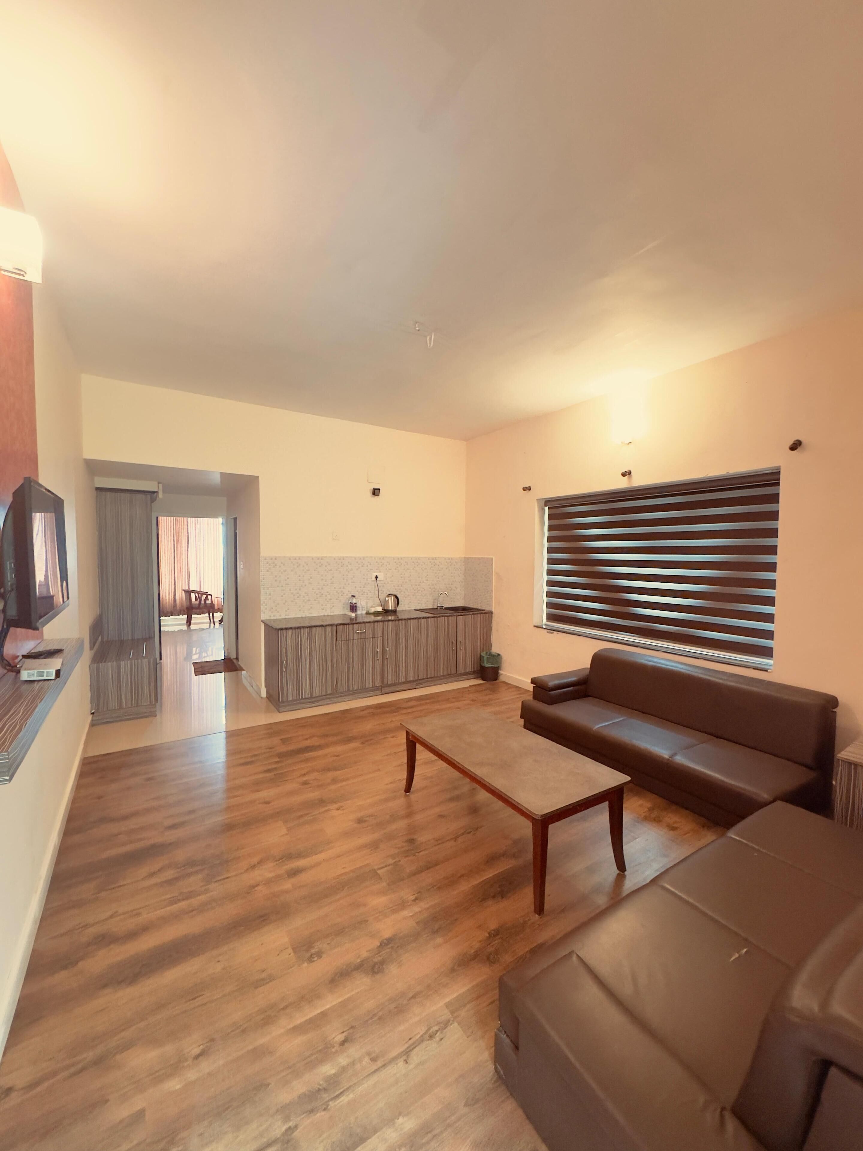 Family Suite, Mountain View | Living area | 34-inch LED TV with satellite channels