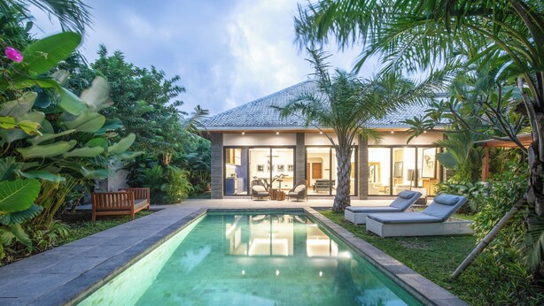 A modern house with a swimming pool, surrounded by lush greenery. - Elegant 3BR Retreat Stylish Modern Villa Seminyak (Seminyak)