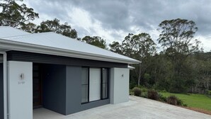 A modern two-story house with a grey exterior and a covered driveway. - The Ponds at Mudgeeraba 4 bedroom Modern House great central location (Mudgeeraba)