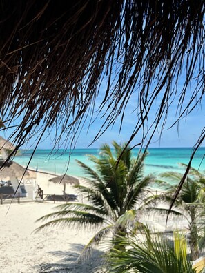 On the beach, sun-loungers, beach towels - Beachfront 3 Bdrs. Villa Apartment, Private Beach, Chef, Pool, Kayaks, Wi-Fi (Playa del Secreto)