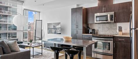 Coffee/tea maker, fridge, microwave, oven