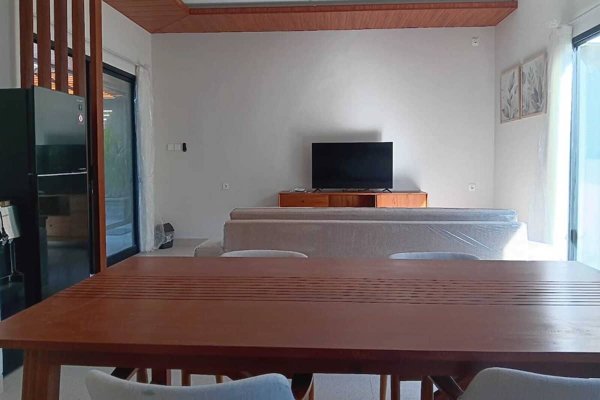 Family Villa, Garden View | Living area | 50-inch Smart TV with cable channels, Netflix, streaming services