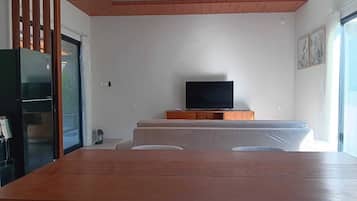 Family Villa, Garden View | Living area | 50-inch Smart TV with cable channels, Netflix, streaming services