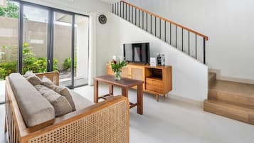 Family Villa, Garden View | Living area | 50-inch Smart TV with cable channels, Netflix, streaming services