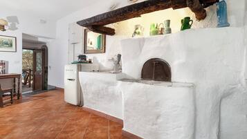 Departamento Confort, vista al jardín | Cocina privada | Periquera