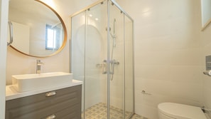 Shower, hair dryer, towels, toilet paper