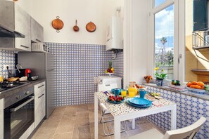 Departamento Deluxe, balcón | Cocina privada