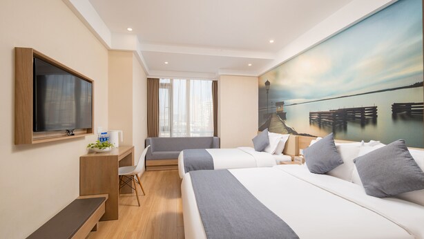 A hotel room with two beds, a desk, a chair, a TV, and a large window with curtains. - Zhishang Hotel Hangzhou West Lake Zheyi  (Hangzhou)