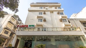 A multi-story building with a sign reading "KABER HOTEL". - Hotel Kabeer New Delhi Railway Station  (New Delhi)