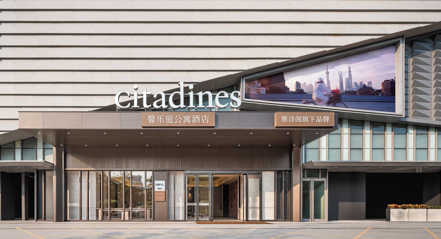 A modern building with a large sign reading 'citadines'.