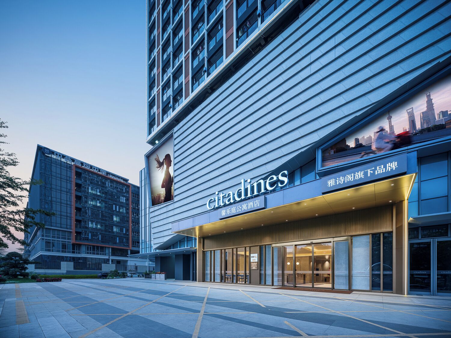 A modern hotel with a prominent 'citadines' sign, large windows, and a clean, contemporary design.