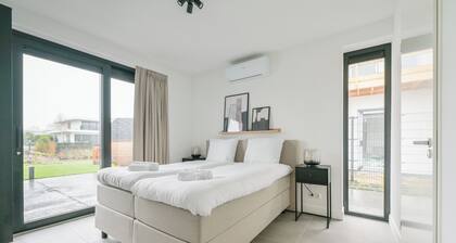 Luxurious 8-person villa with hot tub, sauna, spacious waterfront garden with barbecue and private jetty – perfect for ultimate relaxation and comfort.