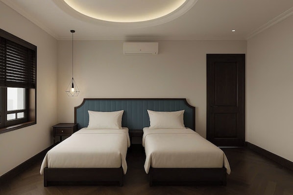 Habitación Deluxe con 1 cama doble o 2 individuales, vistas a la ciudad | Escritorio, tabla de planchar con plancha, wifi gratis