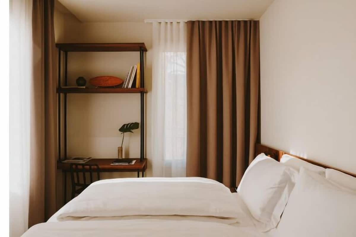 Premium bedding, down duvets, in-room safe, desk