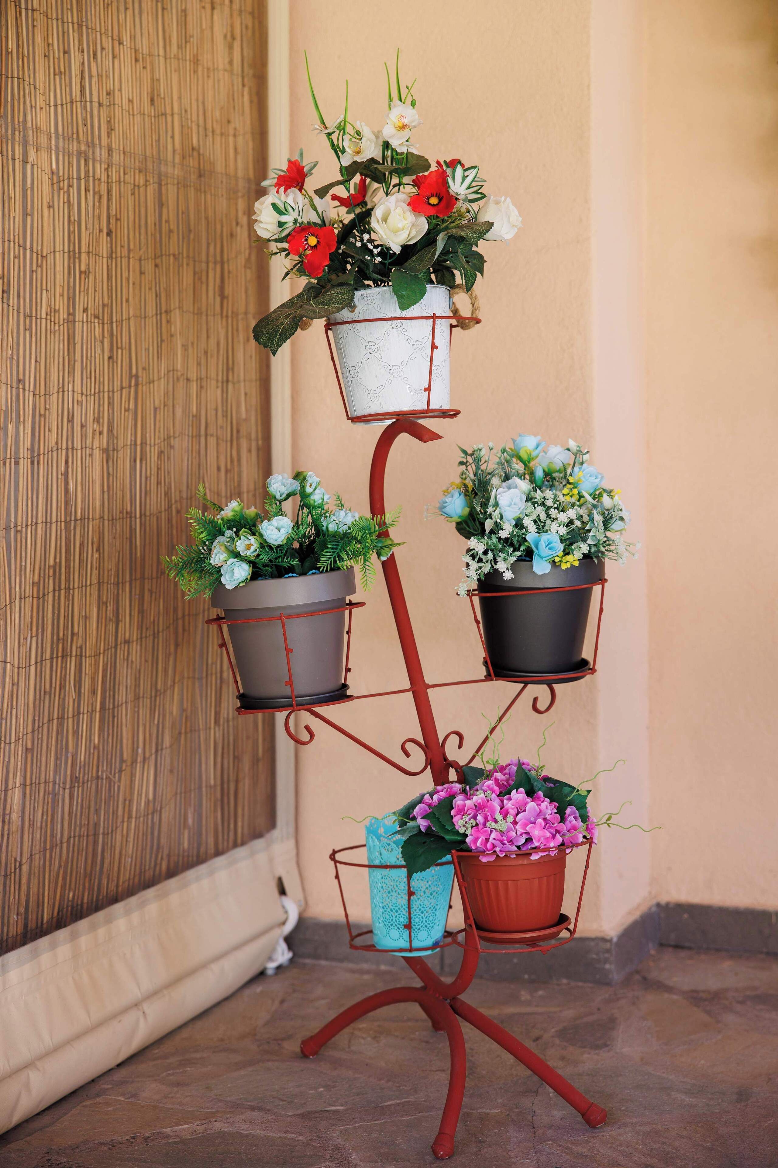 Colorful plant stand adding charm and character to the outdoor space.