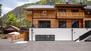 A wooden building with a sign reading 'Lorenz Alte Mühle Restaurant-Bar-Grill.'