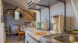 Fridge, microwave, stovetop, coffee/tea maker