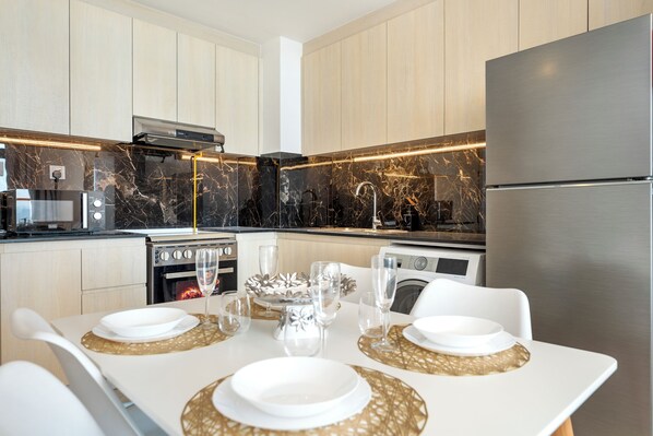 Departamento Deluxe, 1 habitación, para no fumadores, vista a la ciudad | Cocina privada