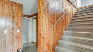 A staircase with wooden walls and carpeted steps. - Near Tennessee River! Pet-friendly Family Cottage! (Savannah)