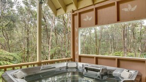 A hot tub with a view of a forest. - 3 Mi to Hawaii Volcanoes NP: Spacious Home w/ Deck (Volcano)