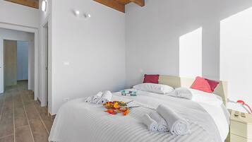 Apartamento família, vários quartos, 2 banheiros (Tana Delle Volpi) | 2 quartos, Wi-Fi de cortesia, roupa de cama