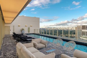 Outdoor pool, open 5:00 AM to 11:00 PM, sun loungers