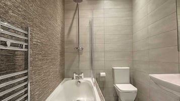 Shower, hair dryer, towels, shampoo