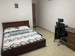 Room, 1 Queen Bed, Microwave | Desk, iron/ironing board, free WiFi - Chapel Hill 2-Bedroom Apartment (Takoradi)