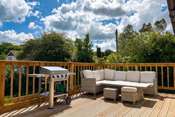 Fire up the BBQ and gather on the wraparound deck under big open skies.