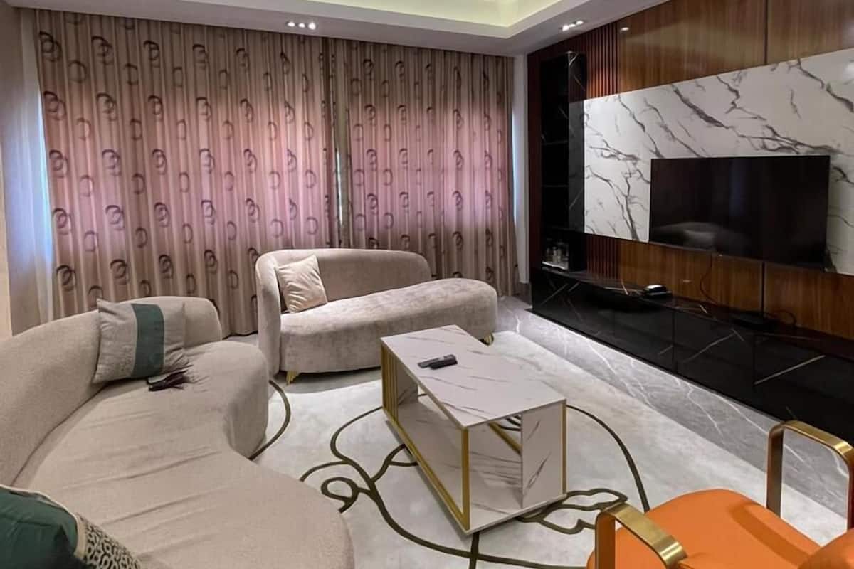 Executive Apartment | Living area | 6-inch LED TV with satellite channels, Netflix, streaming services