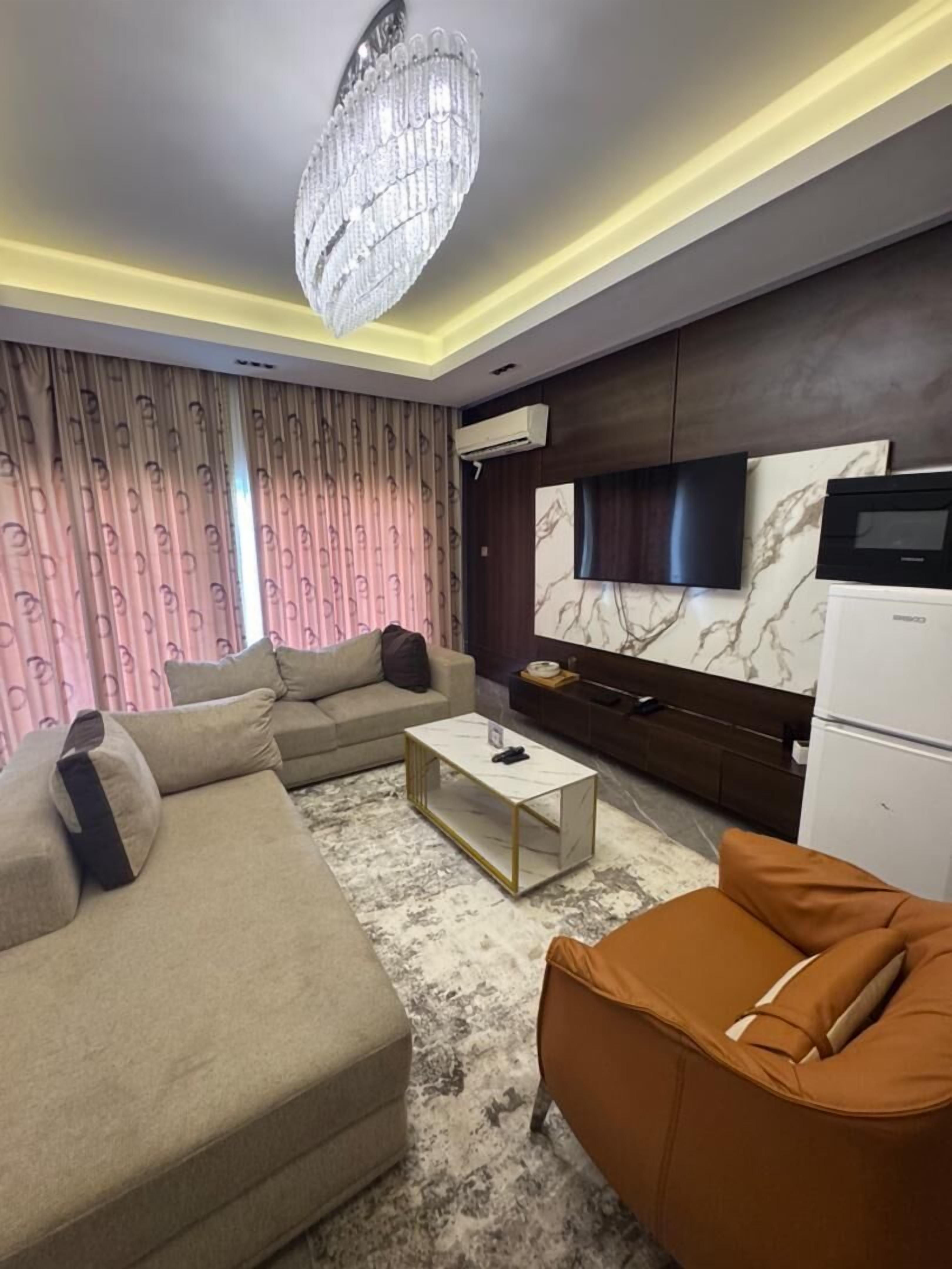 Exclusive Apartment | Living area | 6-inch LED TV with satellite channels, Netflix, streaming services
