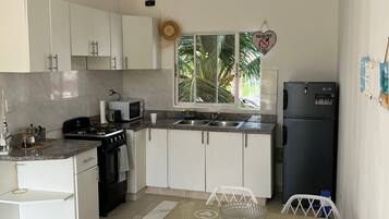 Apartment, Balcony, Pool View | Private kitchen