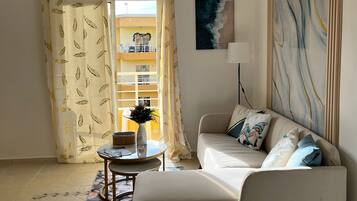 Apartment, Balcony, Pool View | Living area