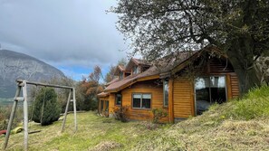 Family House, Patio, Garden View | Courtyard view - Oceana Suites Santa Inés (Coyhaique)