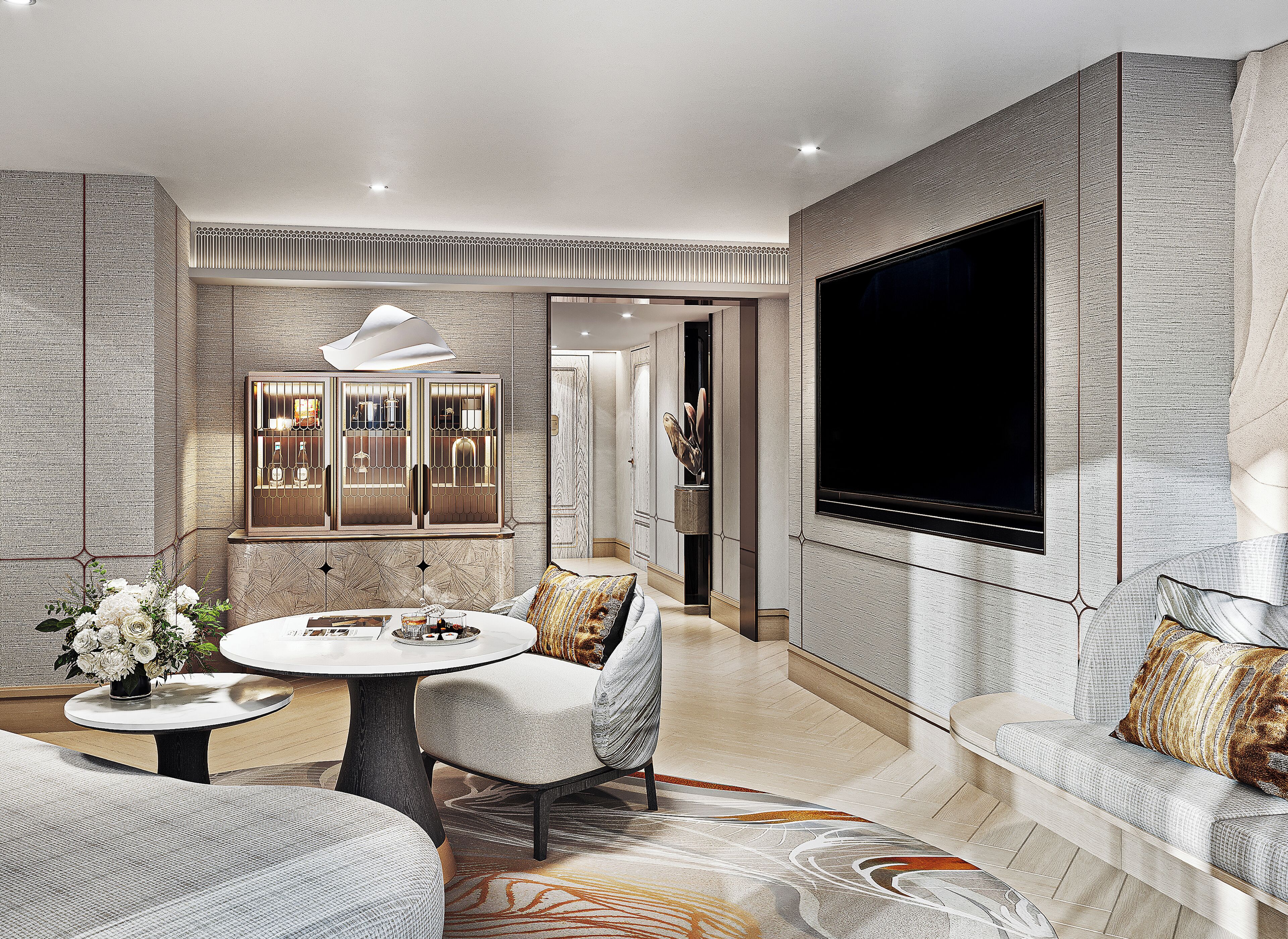 Una sala de estar moderna con una mesa redonda, un sofá, un televisor montado en la pared y un mueble decorativo.