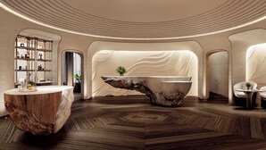 Un espace d’accueil moderne doté d’un comptoir de réception central en marbre, d’un plancher en bois et d’un plafond au design incurvé.
