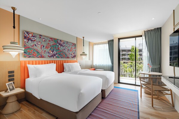 A hotel room with two beds, a large window with a view, a desk, and a television. - Grand Mercure Krabi Aonang (Krabi)