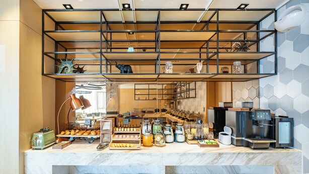 A breakfast bar with a variety of food items and a coffee machine. - Mercure Shanghai Pudong Zhangjiang Park (Shanghai)