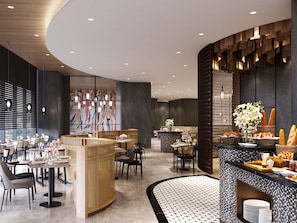 Un restaurante moderno con mesas redondas, una zona de bar central y un suelo con diseño.