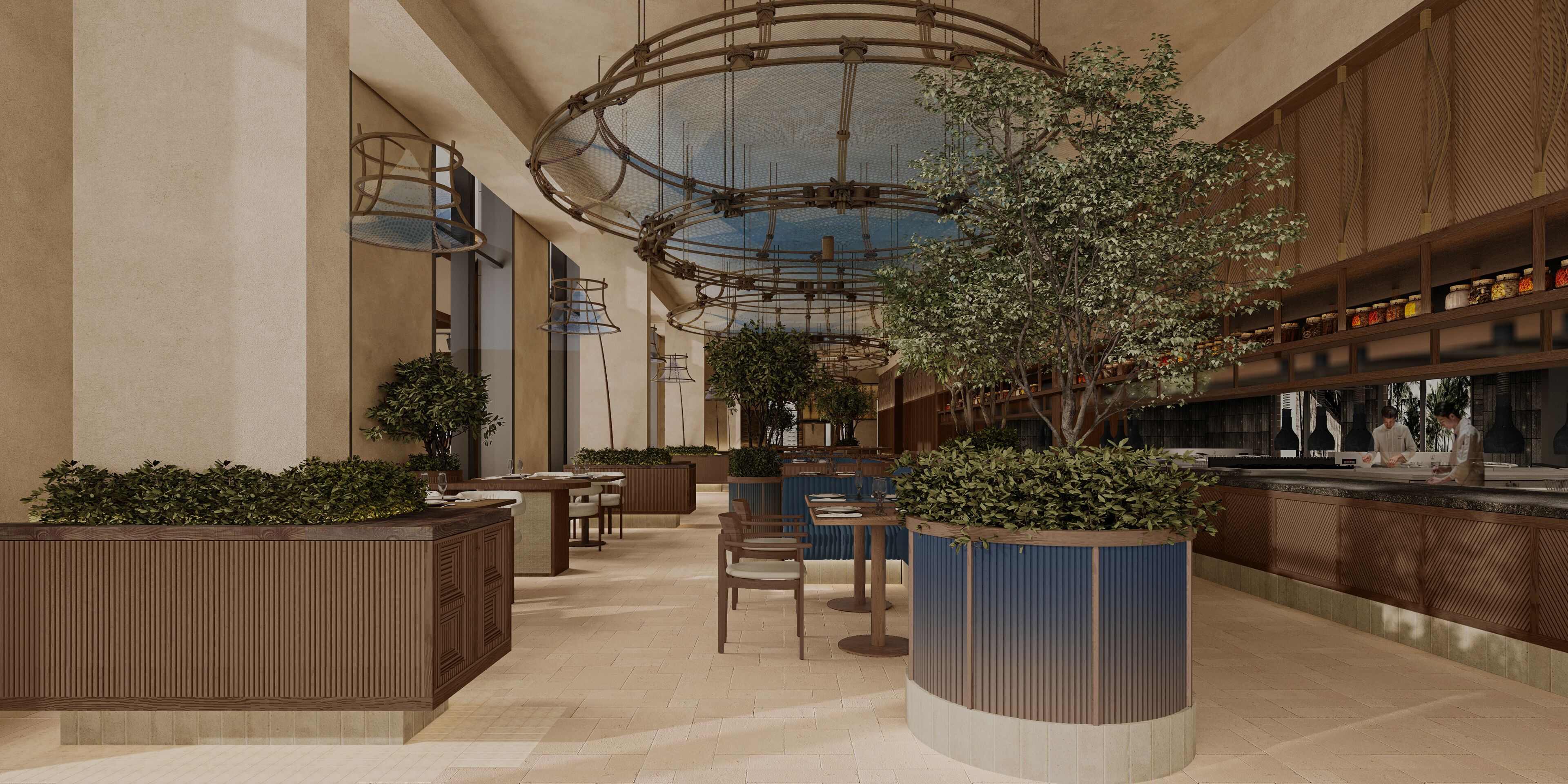 Um espaço amplo e coberto, com assentos, um elemento de decoração com plantas no centro e um bar.