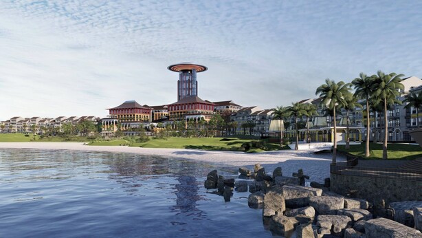 A coastal hotel with a prominent tower, beachfront villas, and a rocky shoreline. - Rixos Phu Quoc Vietnam - Ultra All Inclusive (Phu Quoc)