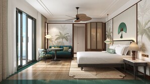 A modern hotel room with a bed, a sofa, a dining table, and a balcony. - Rixos Phu Quoc Vietnam - Ultra All Inclusive (Phu Quoc)